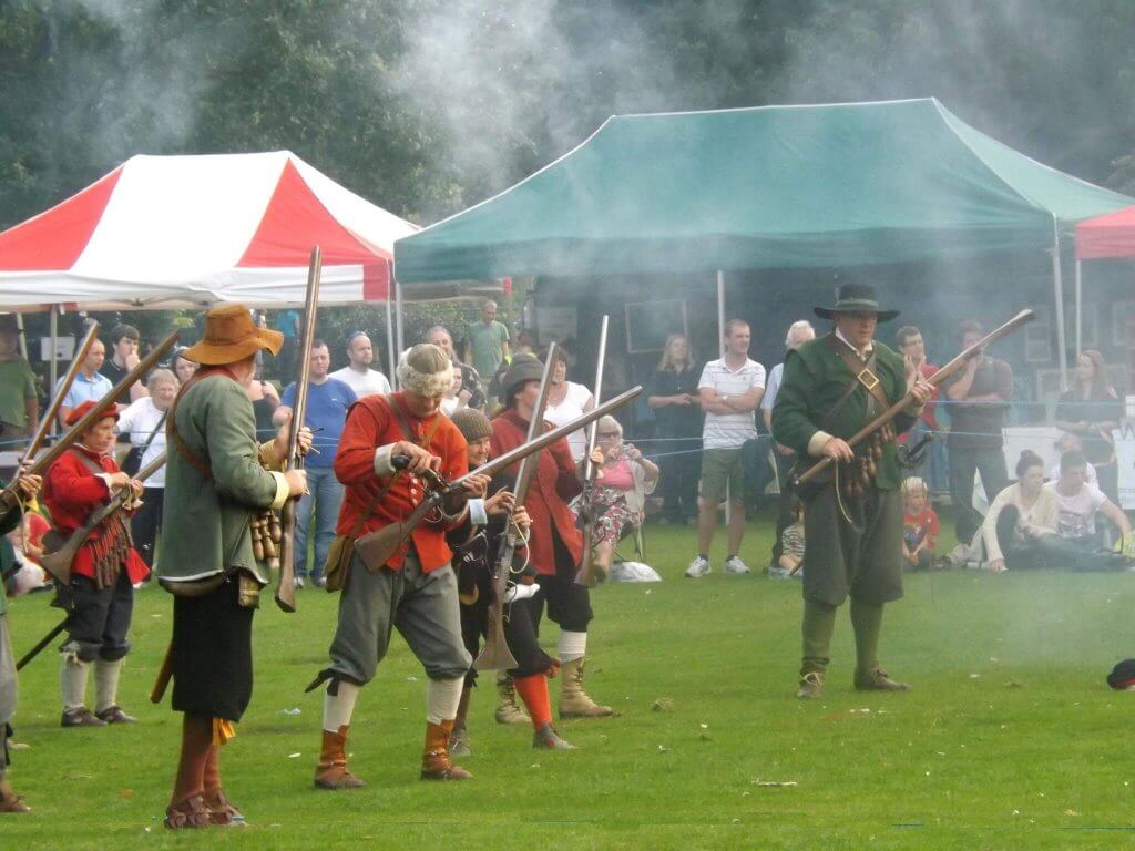 English civil war reenactments with guns at Walton Hall and Gardens Country Fair