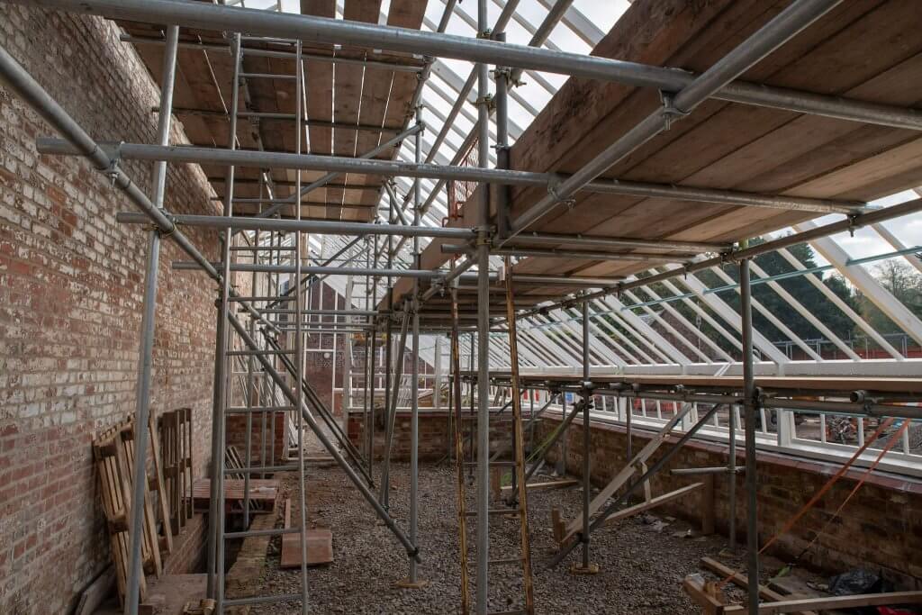 Scaffold erected inside the glasshouses