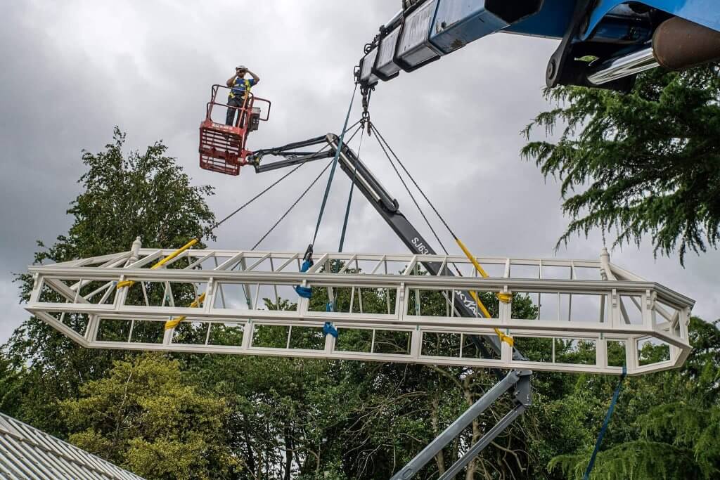 Man on a cherry picker. Picture captured by Andy Gilbert for the glasshouses restoration gallery