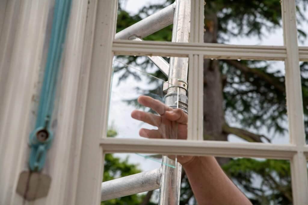 Putting the timer frames into the conservatories. Picture by Andy Gilbert for the glasshouses restoration gallery