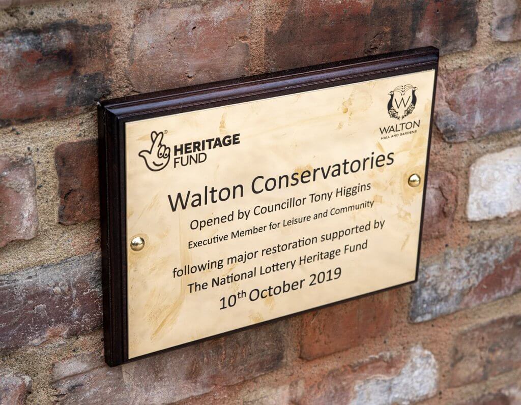 A plaque illustrating the restoration of the conservatories