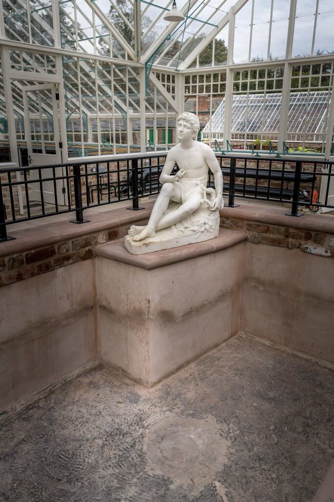 The statue in the empty pool, waiting for water at the newly refurbished glasshuses