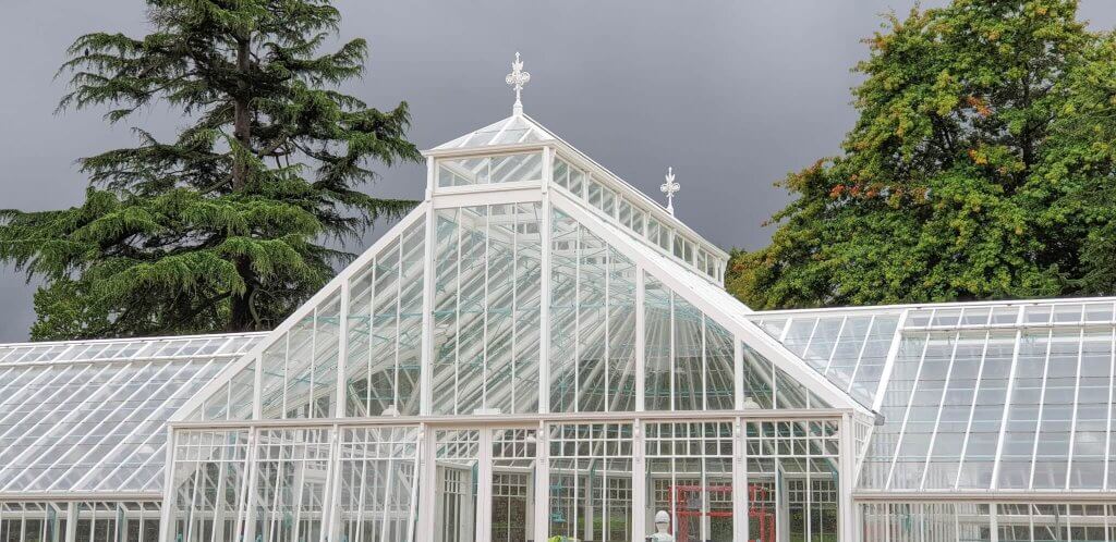 Glasshouses looking stunning under the dark storm clouds