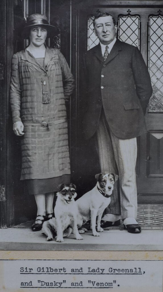 Lord and Lady Daresbury posing with their dog in the entrance to Walton Hall and Gardens. Part of the heritage of the estate.