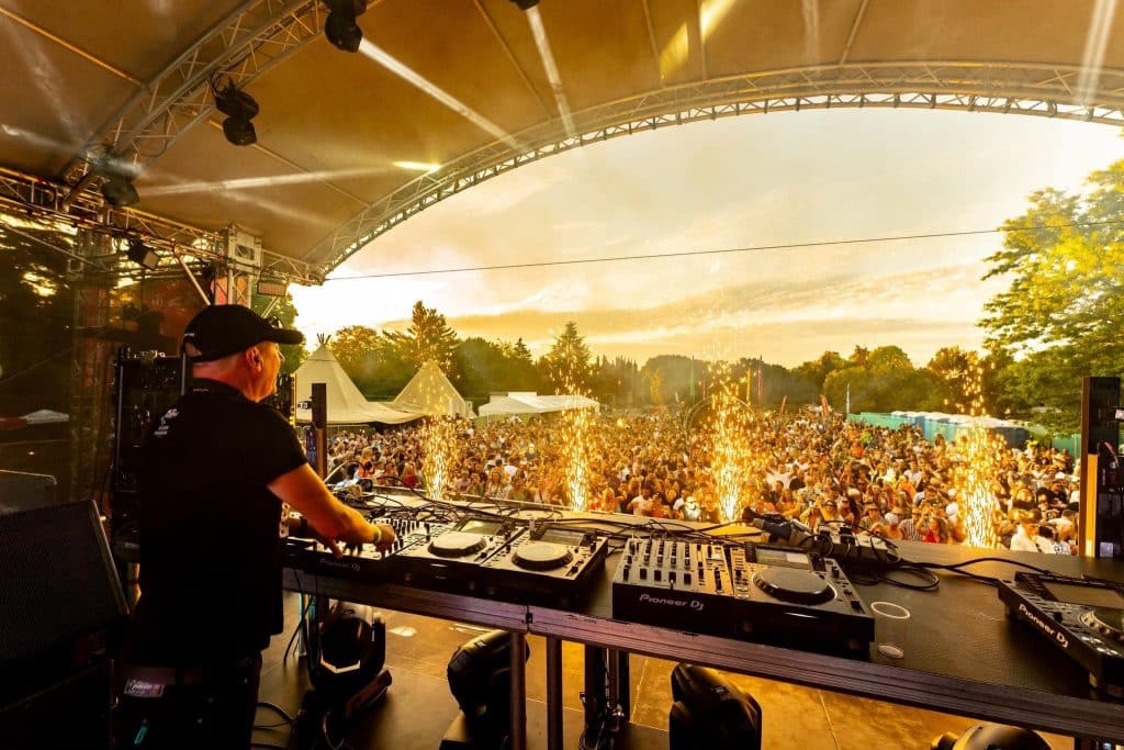 View from the stage at dusk at Daresbury Festival 2023 including stage pyrotechnics.