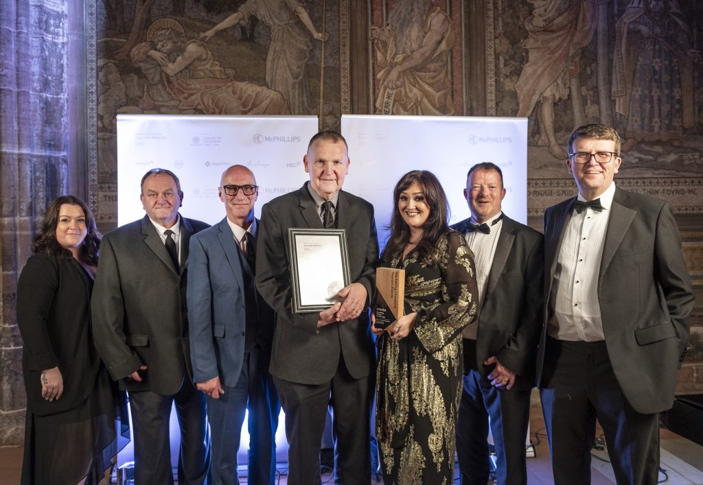 Staff at Walton Hall and gardens pose with their award at Chester Cathedral.