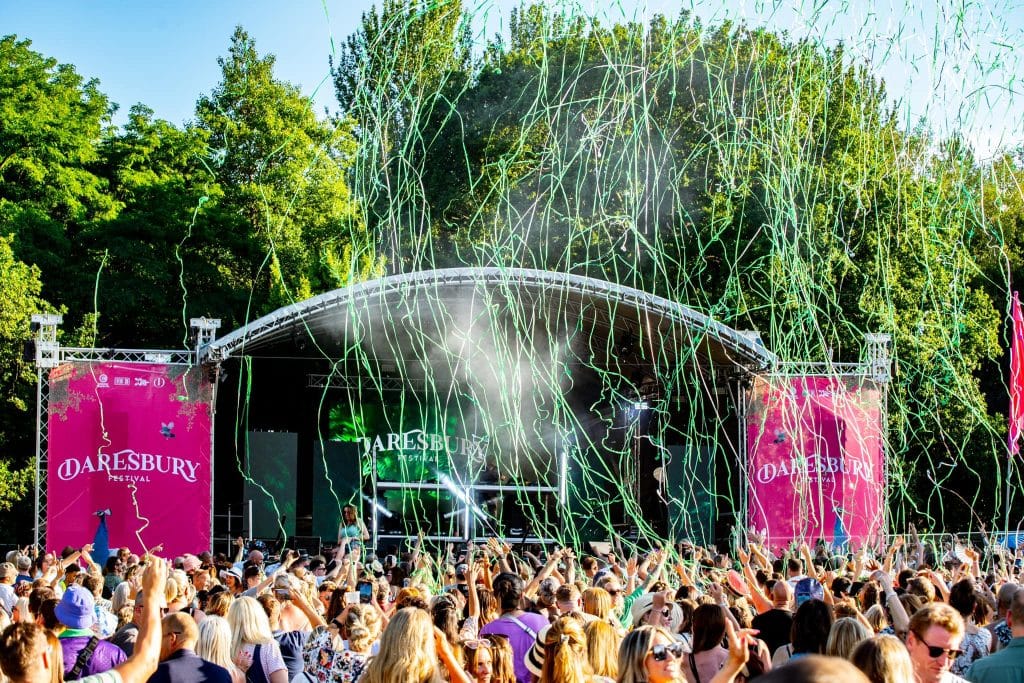 Daresbury Festival stage in 2023 featuring confetti  being launched into crowd.